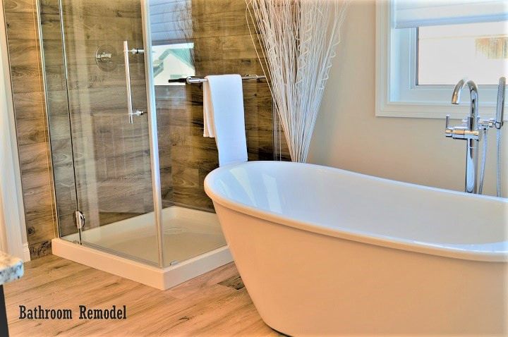 Glass shower and freestanding bathtub with chrome fixtures